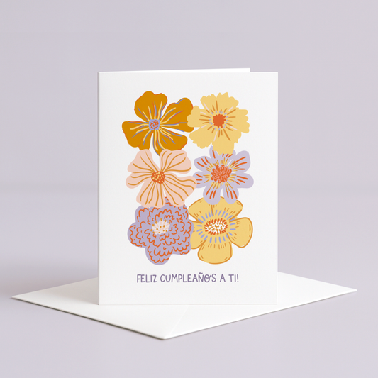 Greeting card with colorful floral design and 'Feliz Cumpleaños a ti!' text on a light gray background